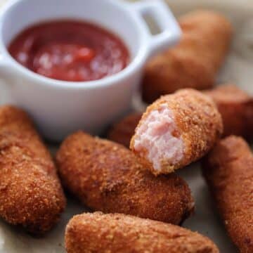 croquetas de jamon with ketchup on the side.