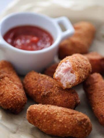 croquetas de jamon with ketchup on the side.
