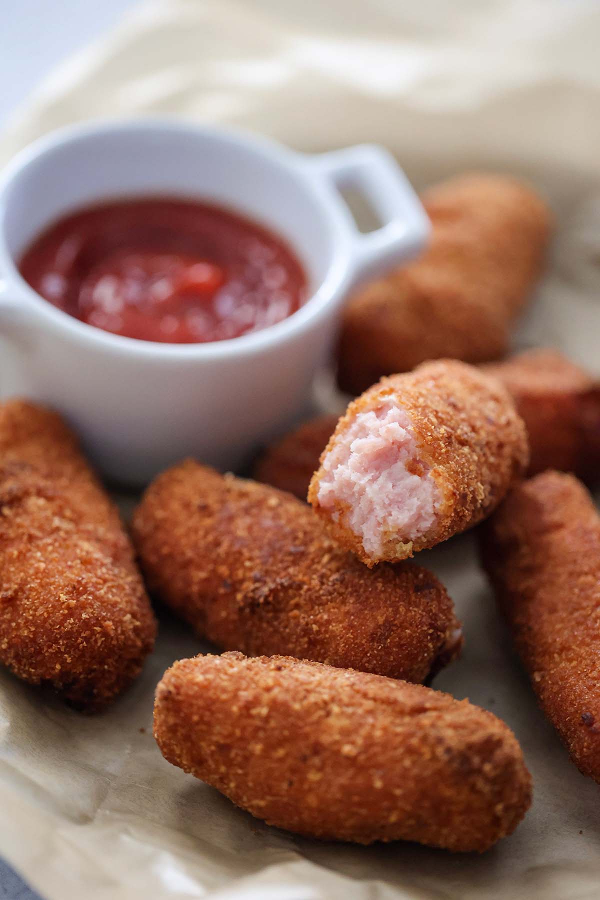 croquetas de jamon with ketchup on the side. 