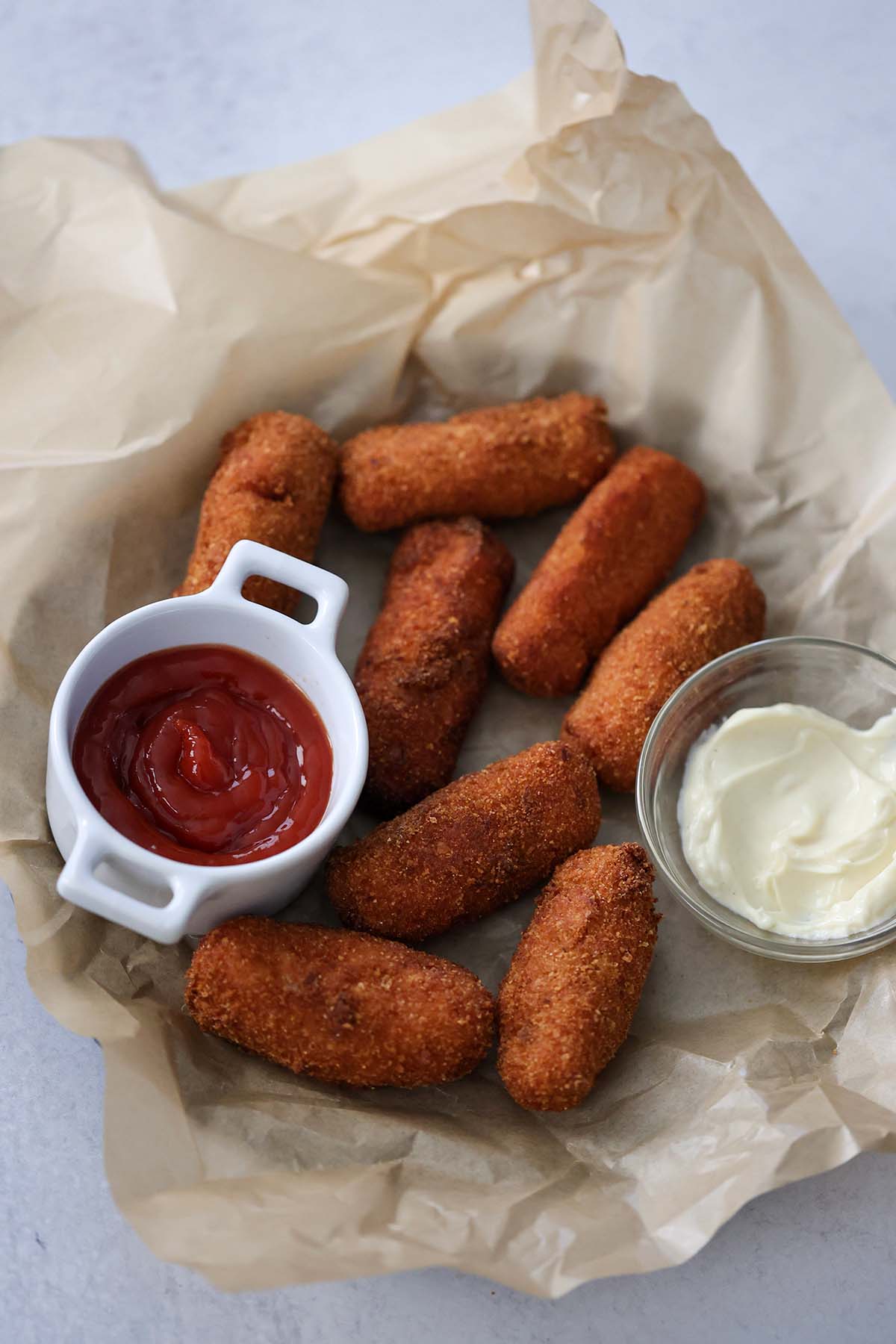 Cuban ham croquettes with ketchup and aioli on the side. 