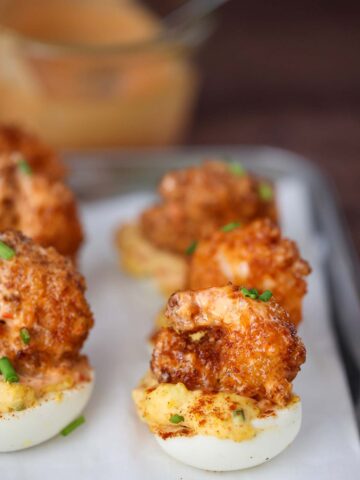 fried shrimp deviled eggs on a plate.