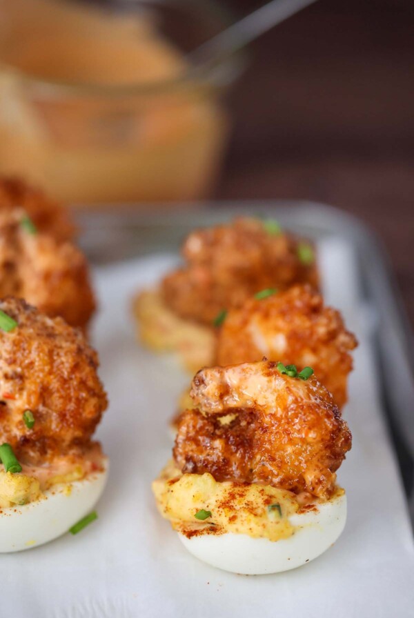 fried shrimp deviled eggs on a plate.