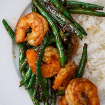 honey shrimp and green beans with white rice on the side.