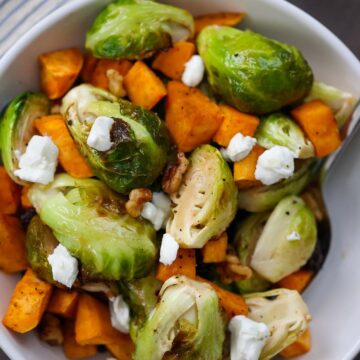 roasted brussel sprouts and sweet potatoes with goat cheese on top.