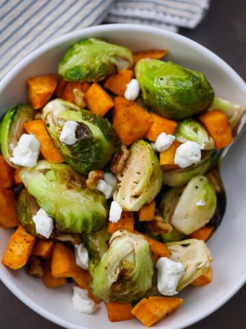 roasted brussel sprouts and sweet potatoes with goat cheese on top.