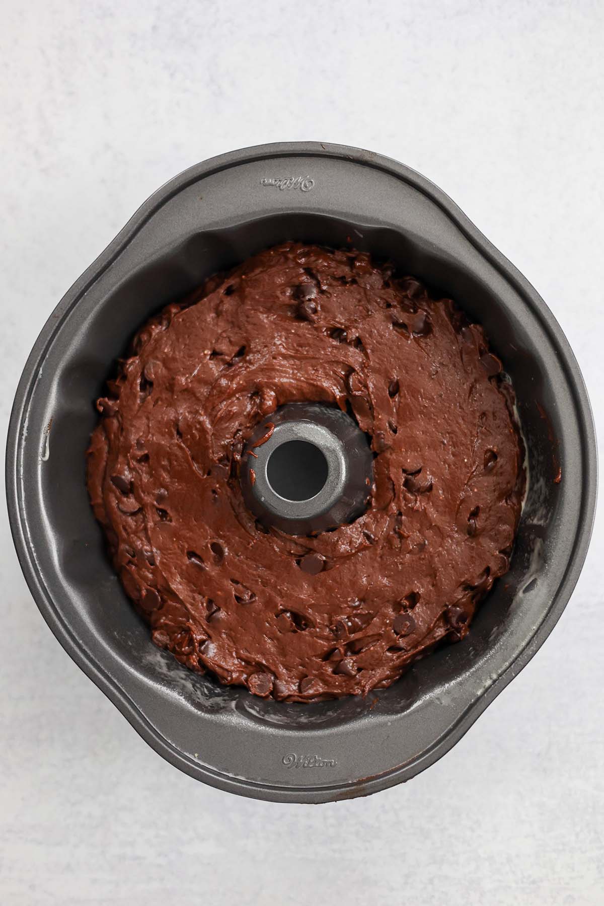 cake batter in a bundt pan. 