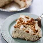 a slice of pecan cream pie on a plate.