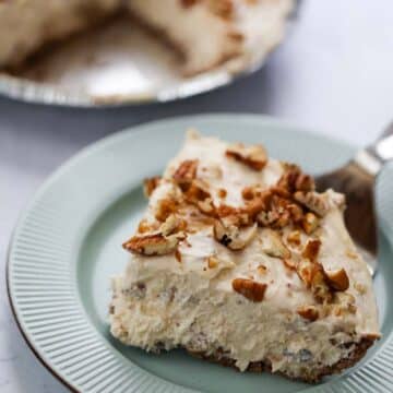 a slice of pecan cream pie on a plate.