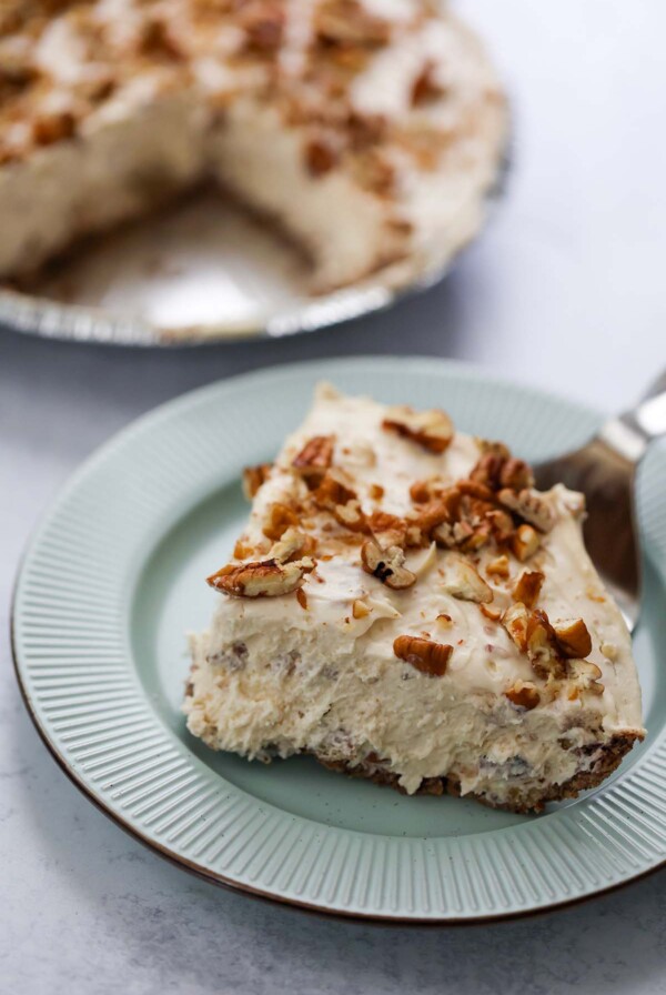 a slice of pecan cream pie on a plate.