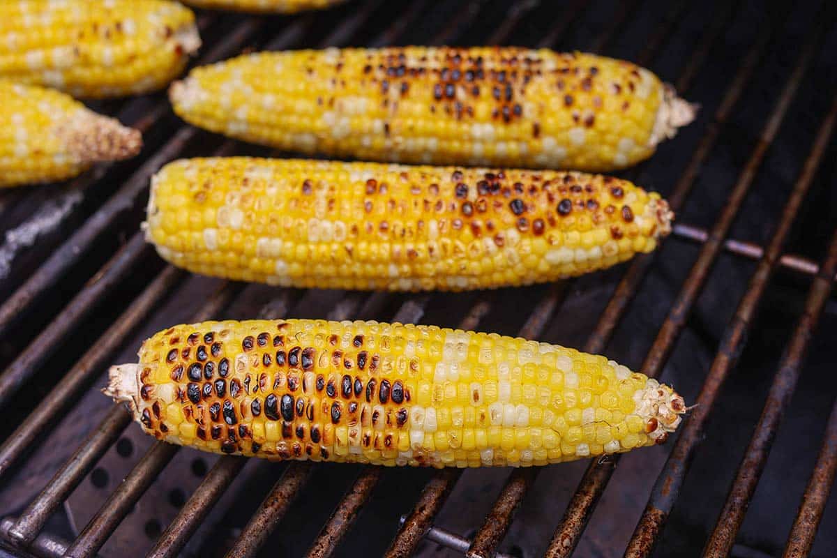 charred corn cobs on the grill. 