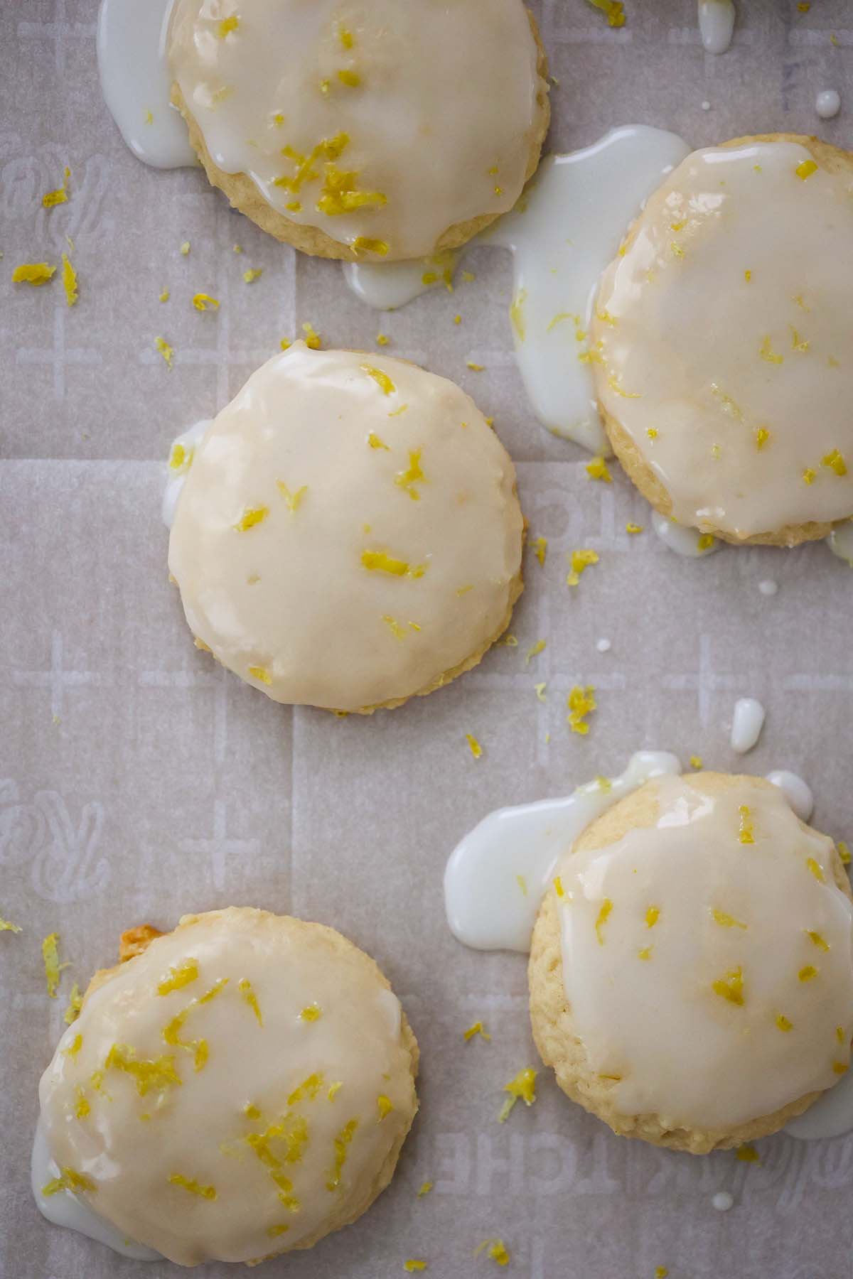 lemon cookies with lemon glaze and lemon zest on top. 