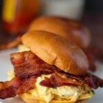 egg salad sandwich with bacon and cheese.