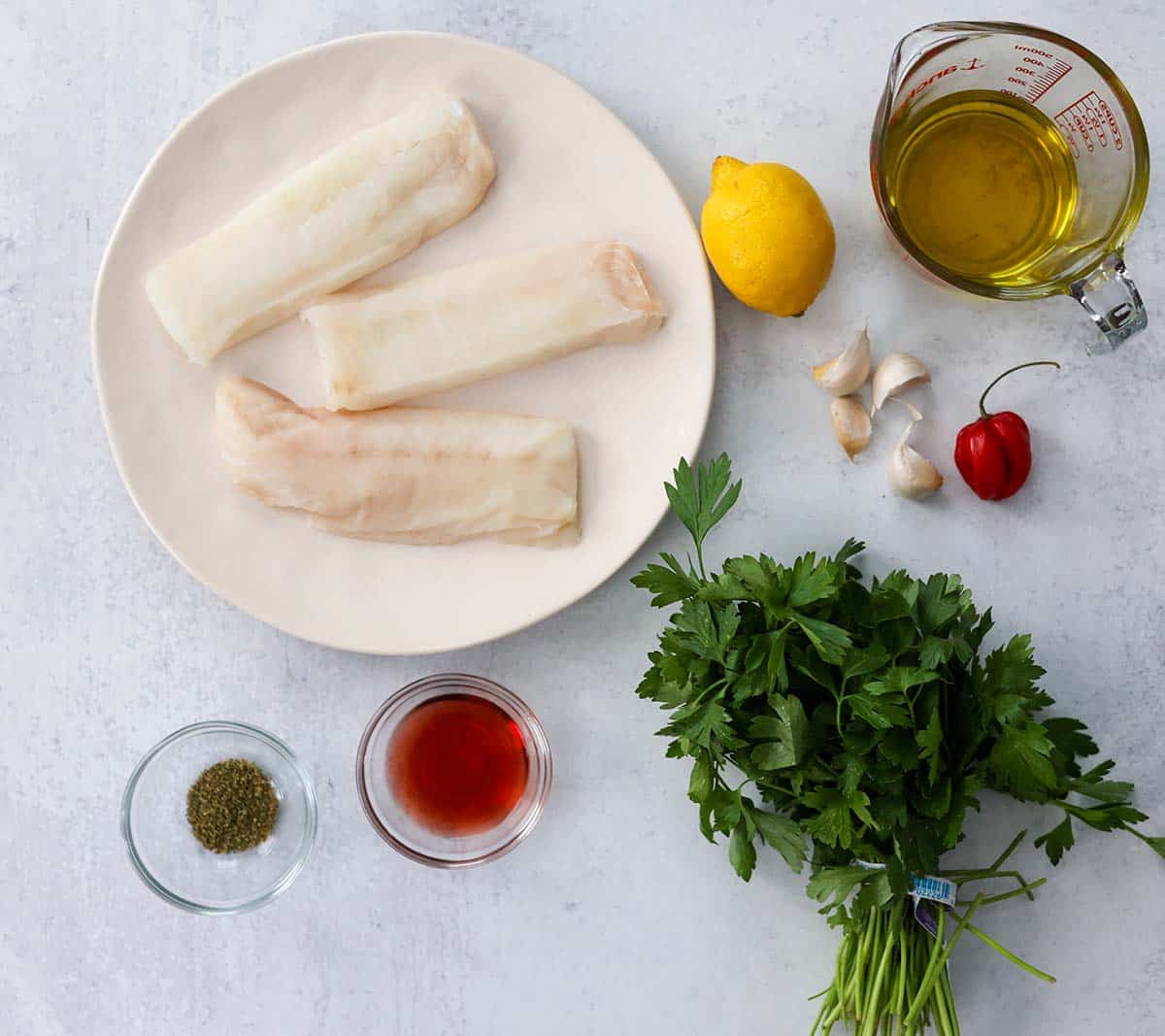 ingredients for cod with chimichurri sauce. 