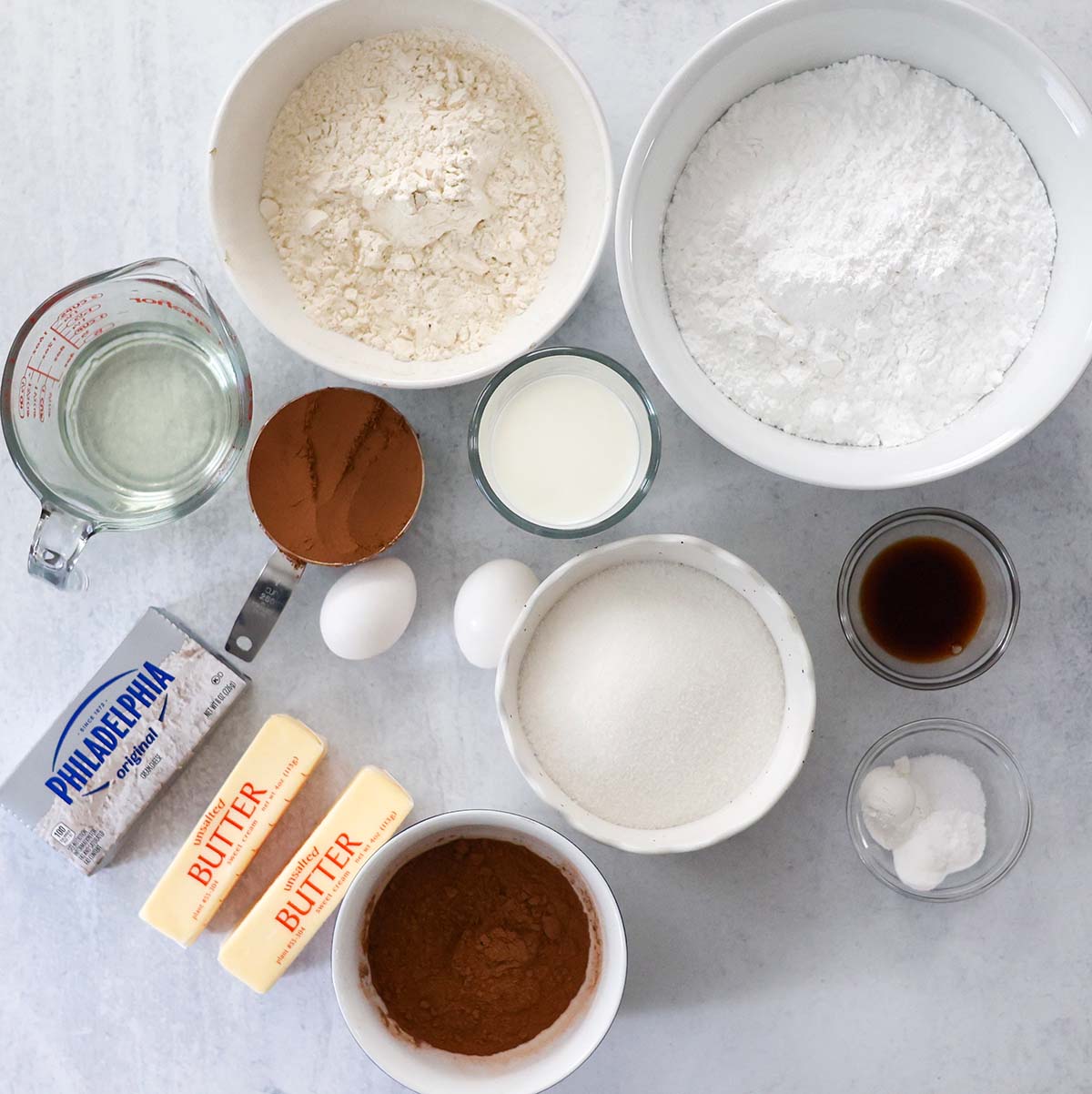 ingredients for chocolate cake and chocolate cream cheese frosting. 