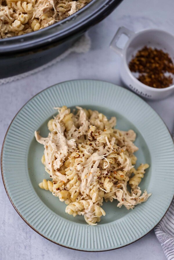 crockpot creamy chicken pasta on a plate.
