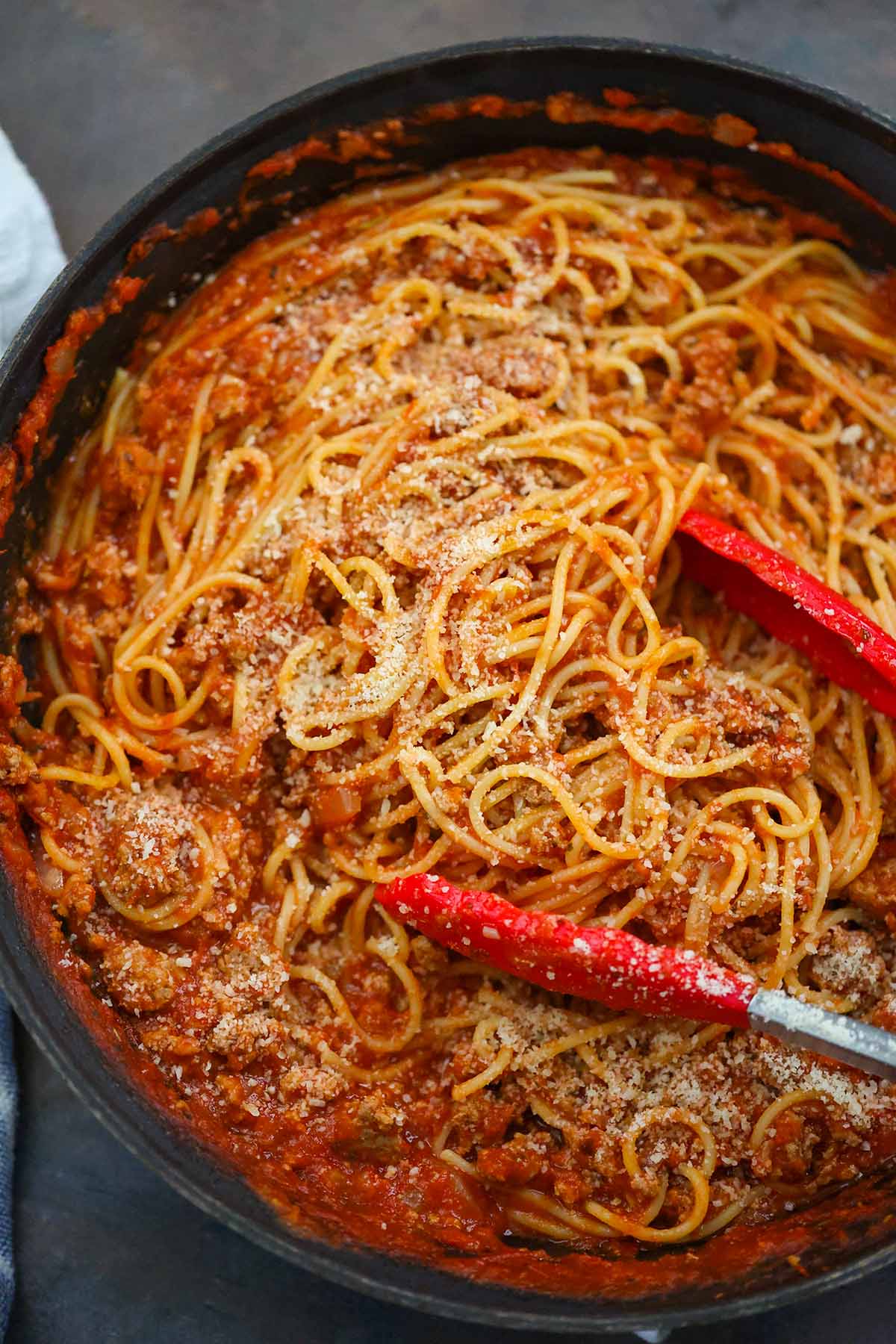Spaghetti with parmesan cheese on top. 