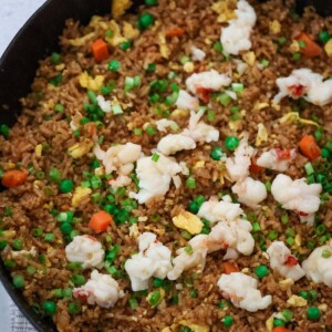 Lobster fried rice in a black skillet.
