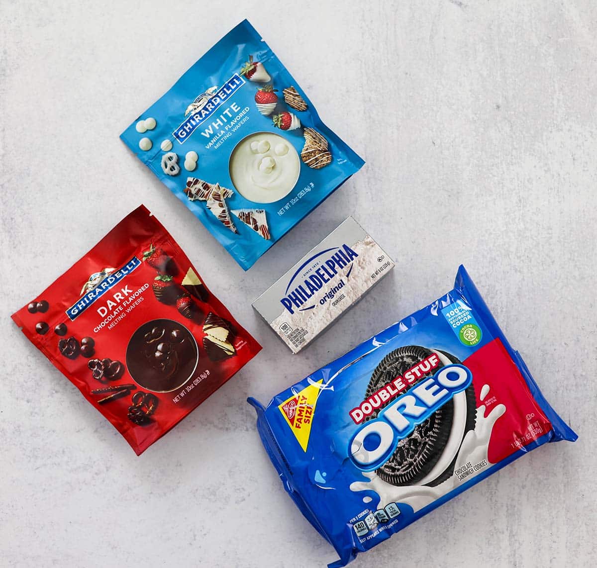 ingredients for oreo balls on a white surface. 