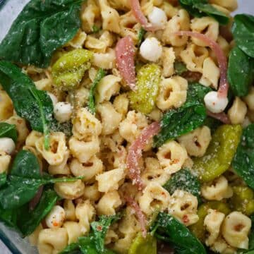 tortellini pasta salad in a glass bowl.