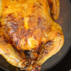 Cuban butter roast chicken in a cast iron skillet.