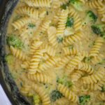 broccoli cheddar pasta in a skillet.