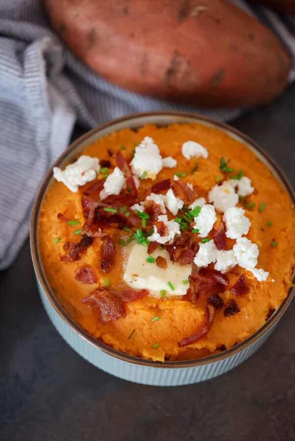 mashed sweet potatoes with goat cheese and bacon on top.
