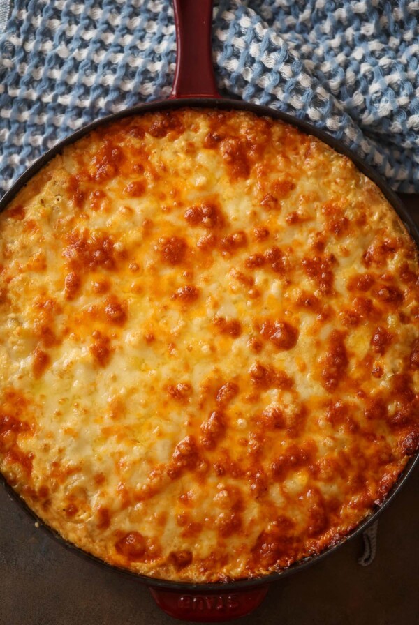 Southern baked mac and cheese in a cast iron skillet.
