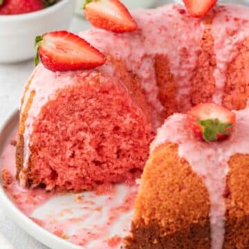 Strawberry bundt cake on a white plate.