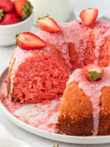 Strawberry bundt cake on a white plate.