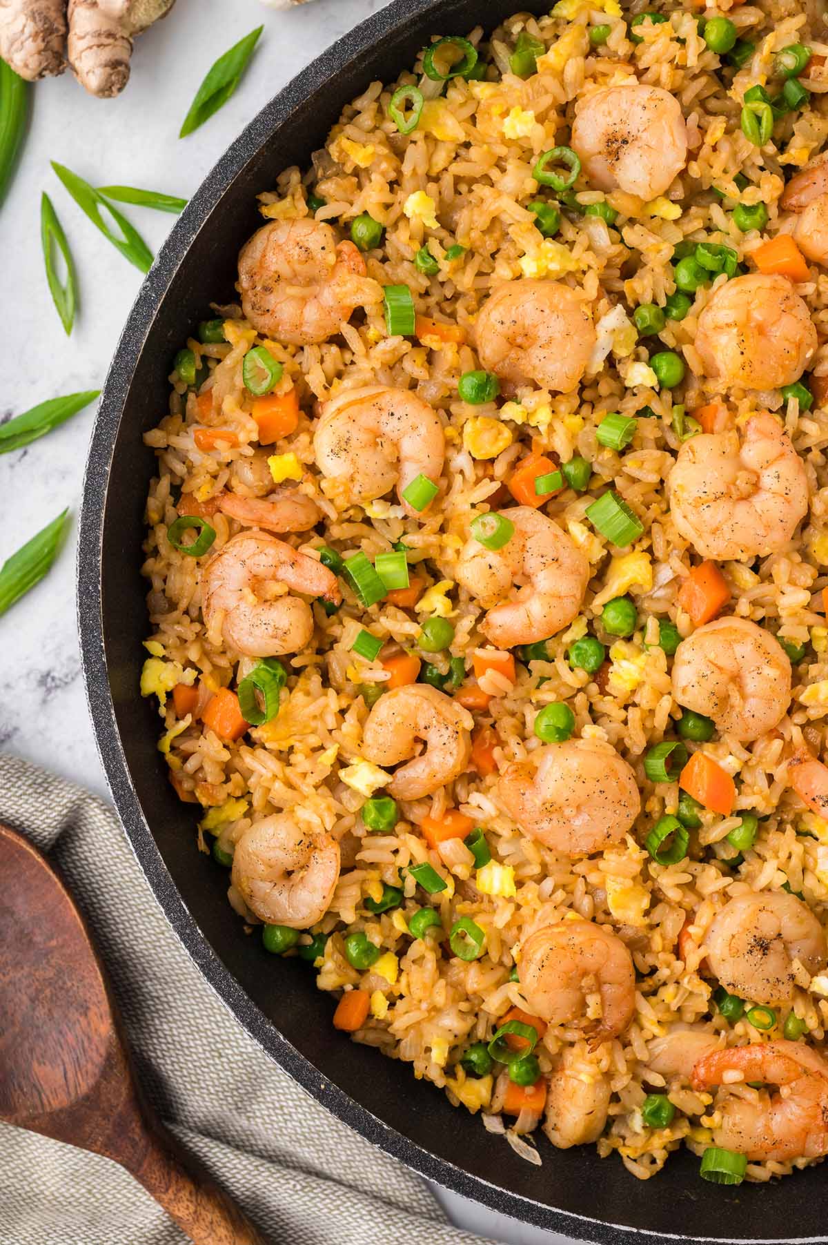 shrimp fried rice in a skillet up close.