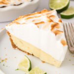 A slice of key lime pie with meringue on top.