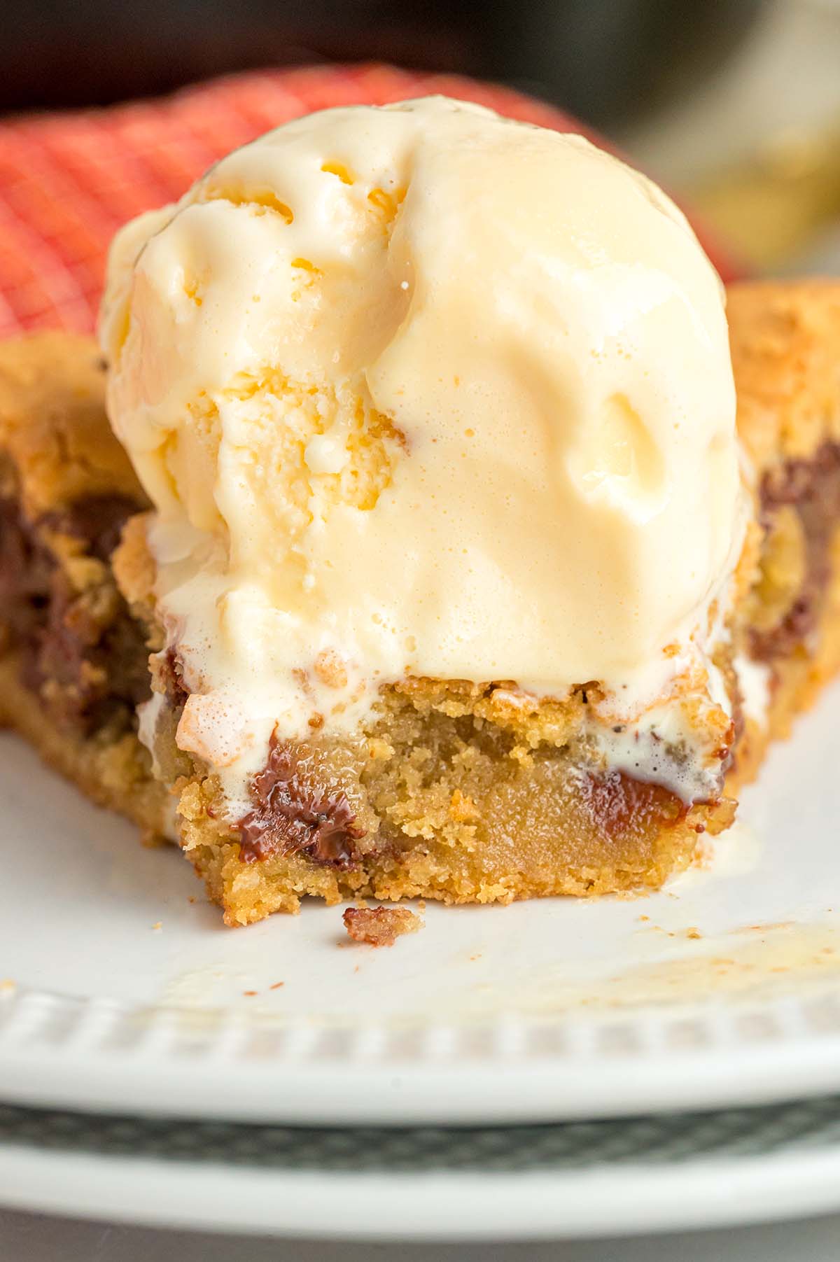 Cookie with vanilla ice cream on top.