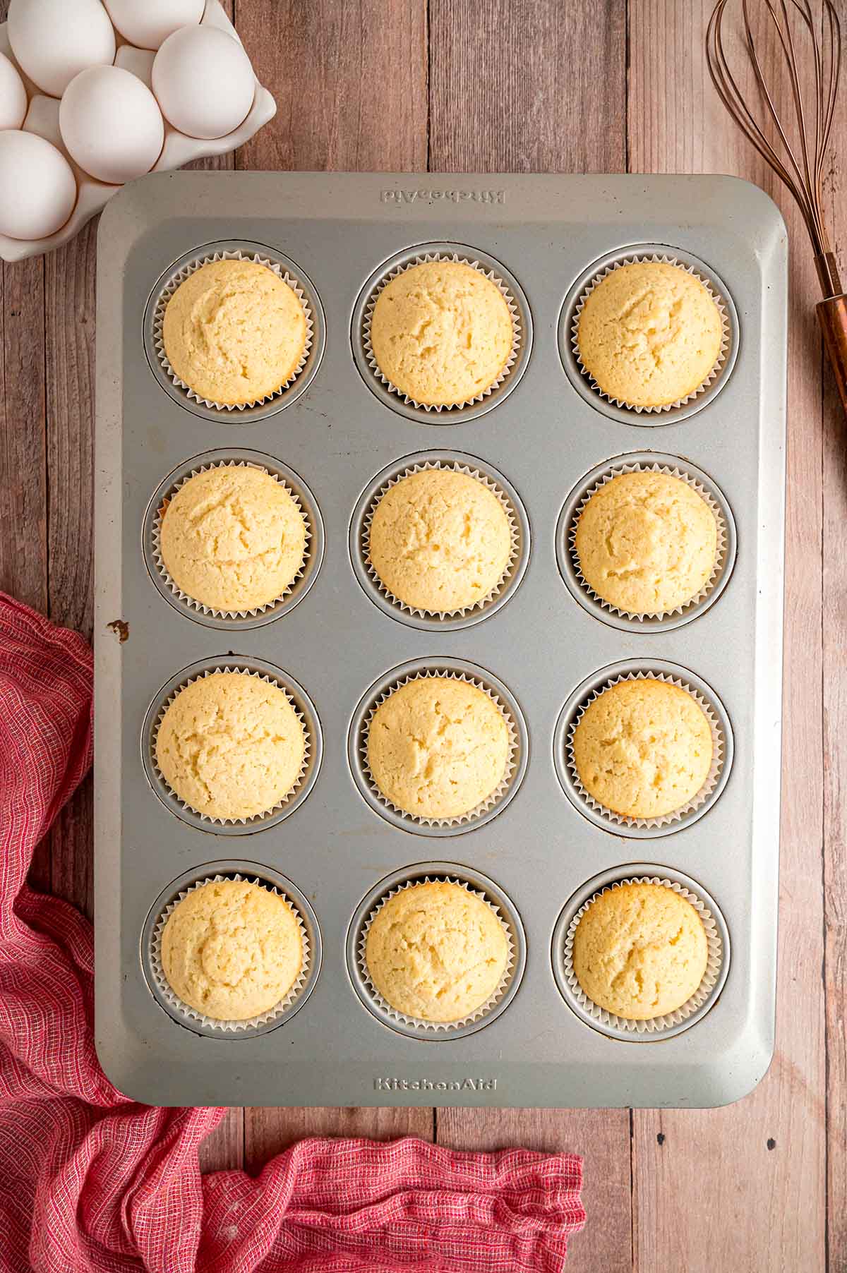 Cupcakes in a cupcake tin without frosting. 