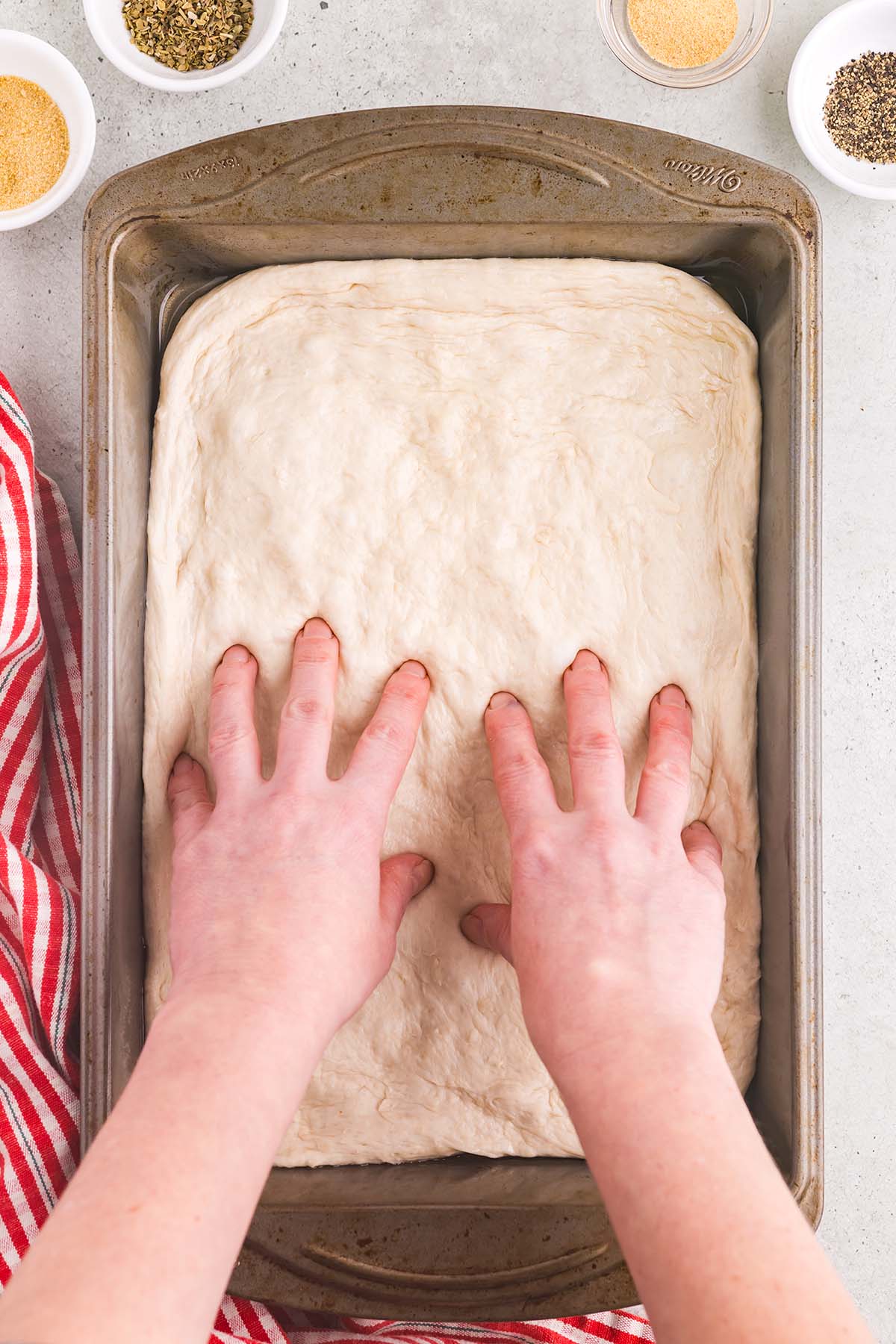Pizza dough in a 9x13 inch pan.