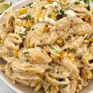 elote pasta salad in a white bowl.