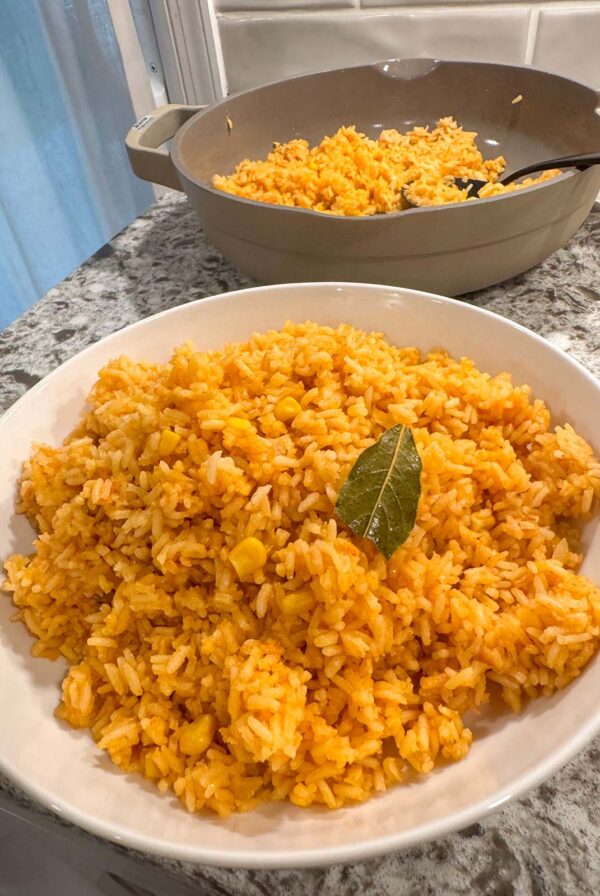 A white bowl filled with Mexican rice.