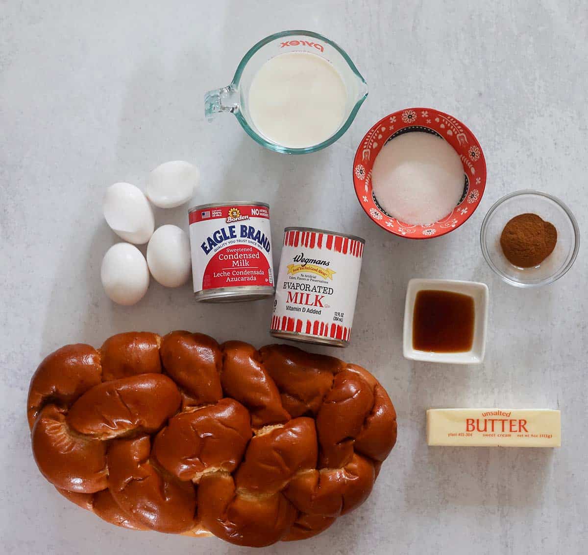 milk, eggs, cinnamon, butter, sugar, bread, vanilla extract, and canned milks.