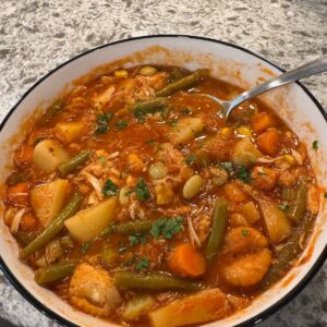 Maryland crab soup in a bowl with a spoon.