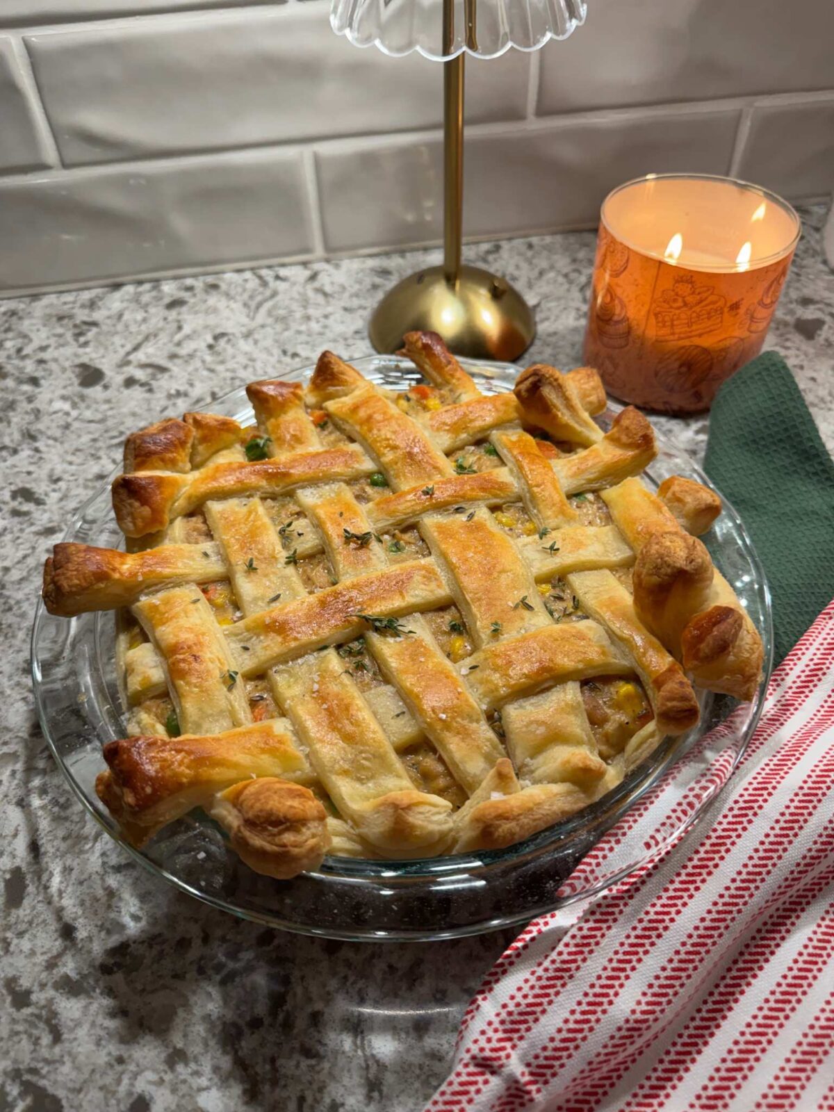 chicken pot pie with puff pastry in a 9 inch baking dish