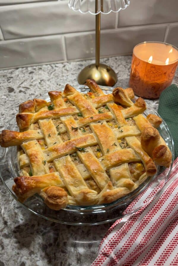 chicken pot pie with puff pastry in a 9 inch baking dish