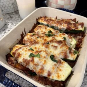 Lasagna stuffed zucchini boats with meat sauce and melted mozzarella.