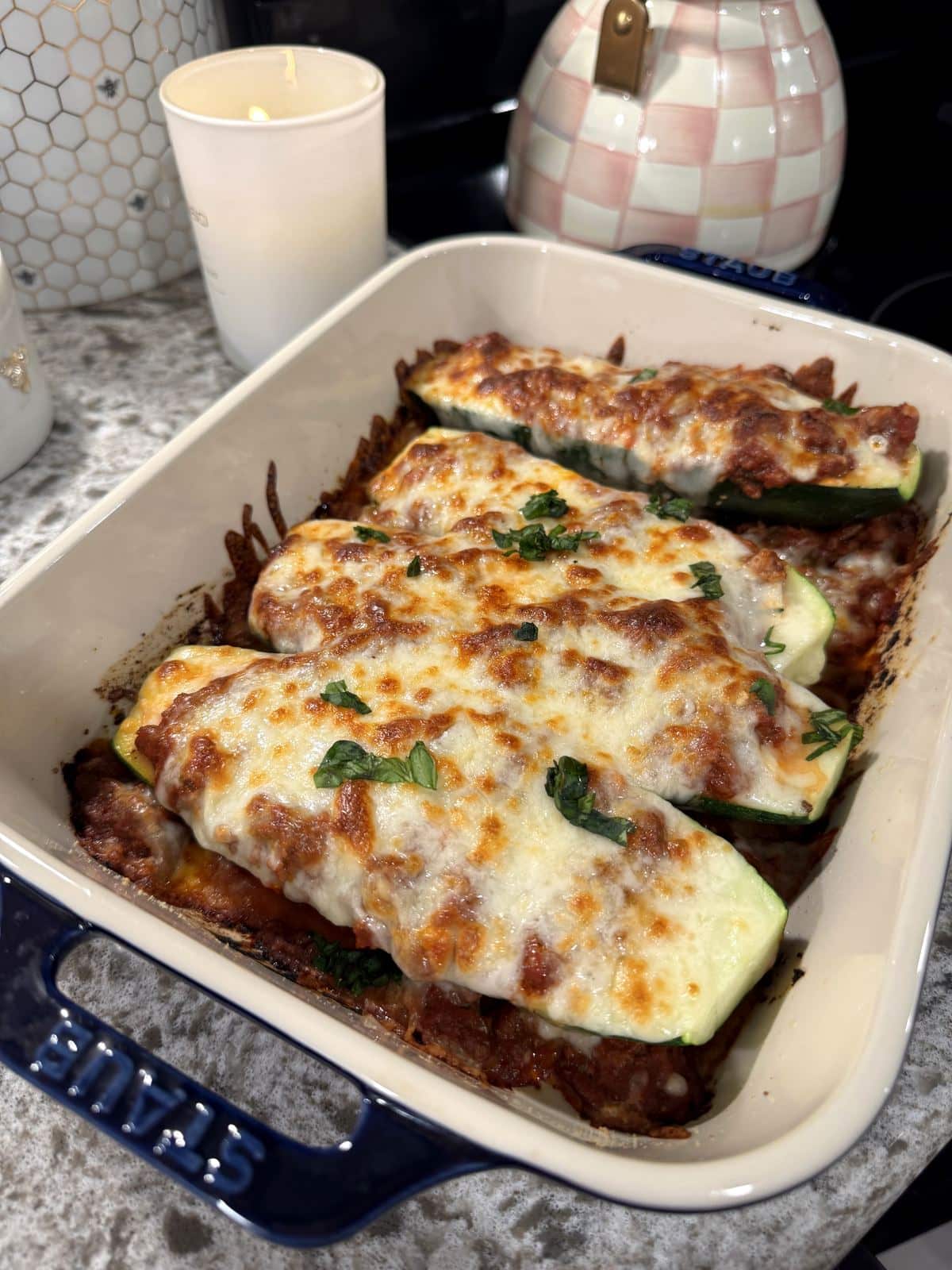 Lasagna stuffed zucchini boats with meat sauce and melted mozzarella.