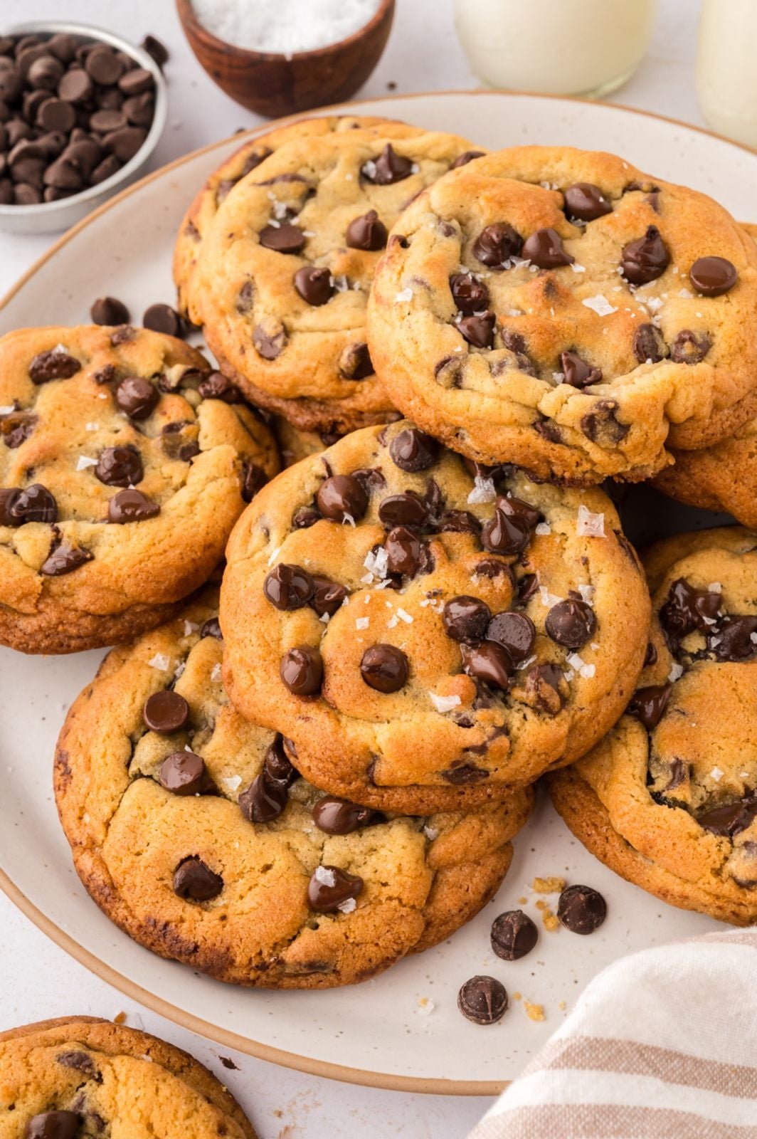 baked chocolate chip cookies with flaky salt on top.