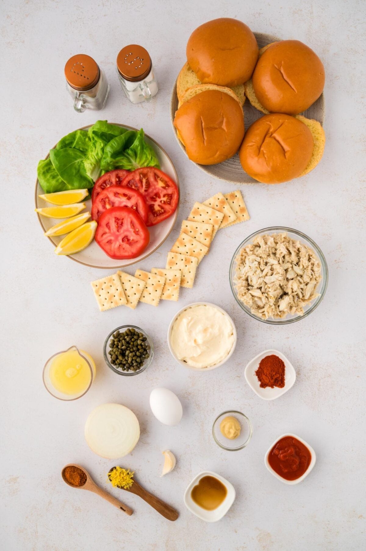ingredients for crab cake sandwiches and remoulade sauce.