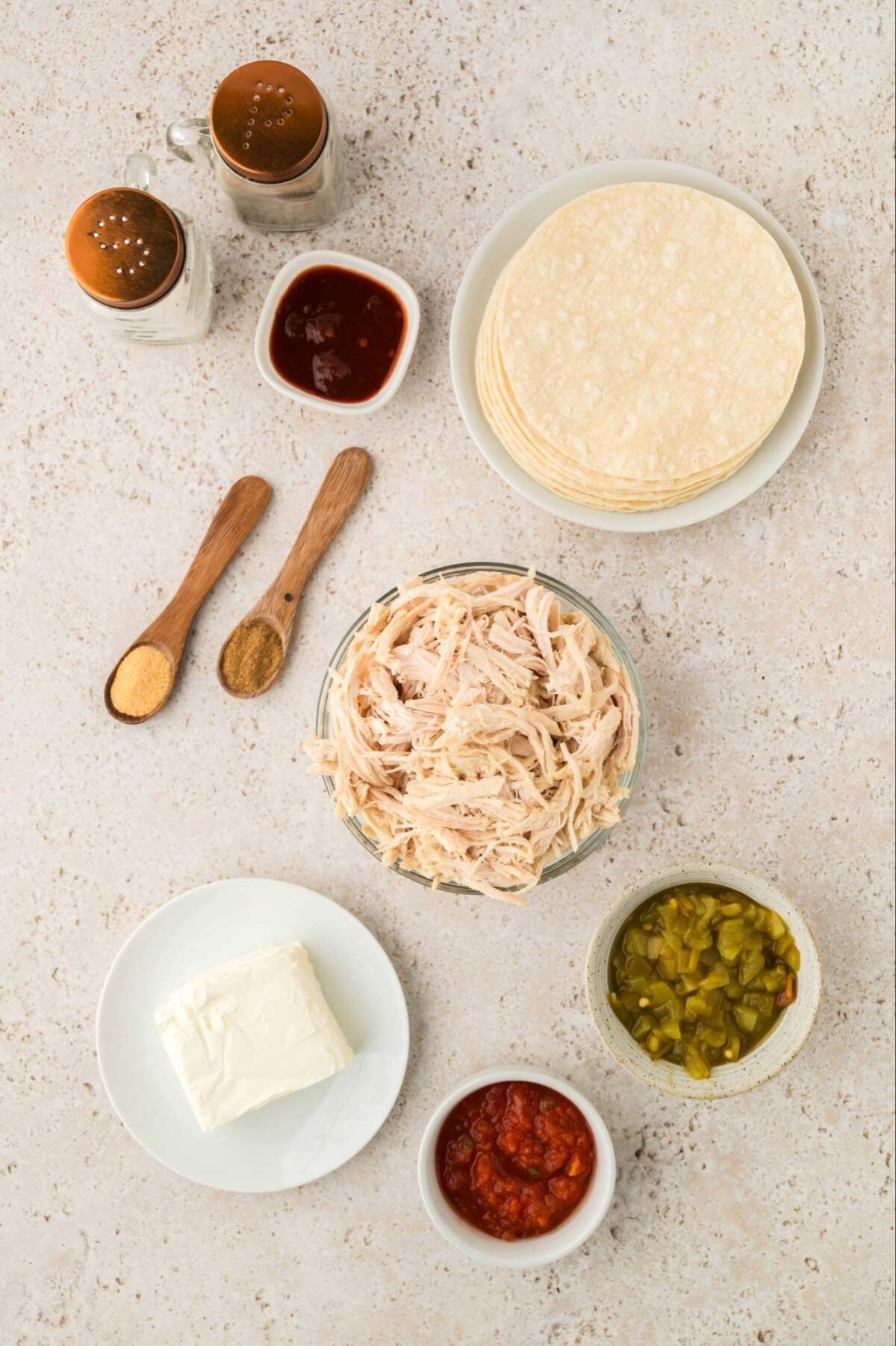 corn tortillas, green chilies, cream cheese, spices, shredded chicken, and chipotle pepper and sauce.