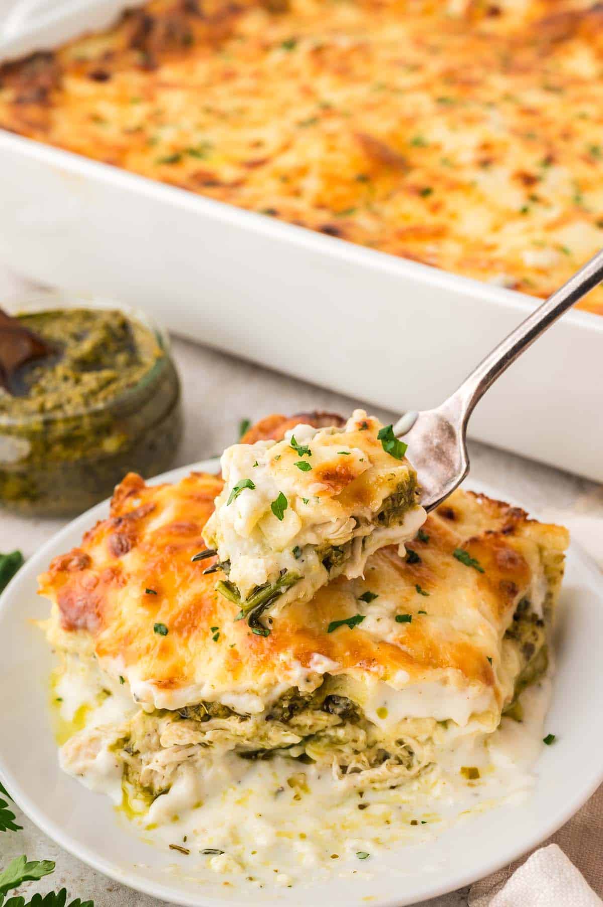 A slice of lasagna with a fork.