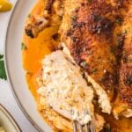 Ruth Chris stuffed chicken up close with a fork.