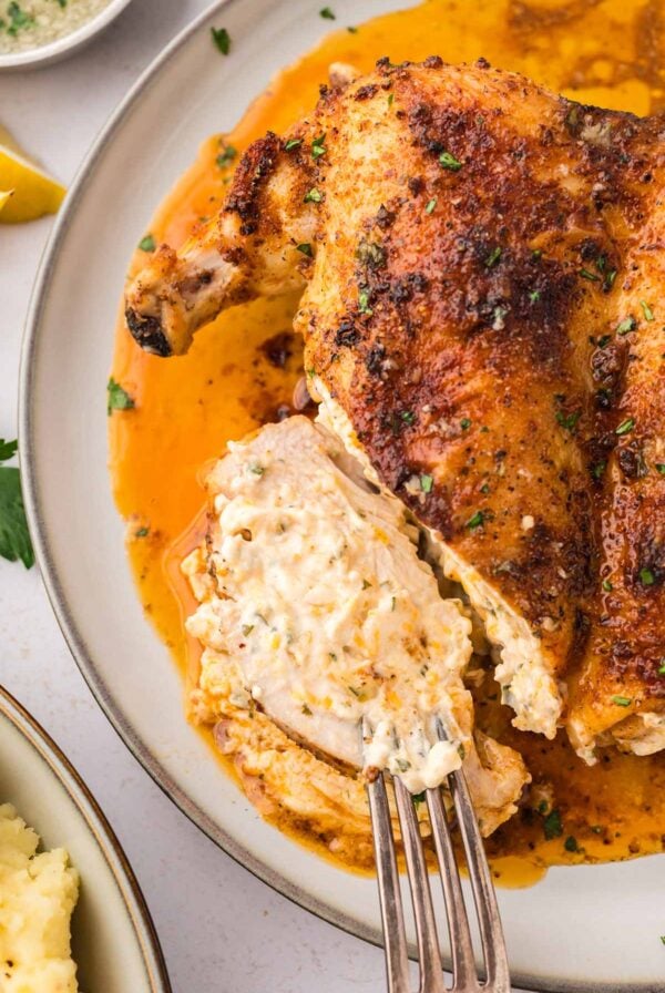 Ruth Chris stuffed chicken up close with a fork.