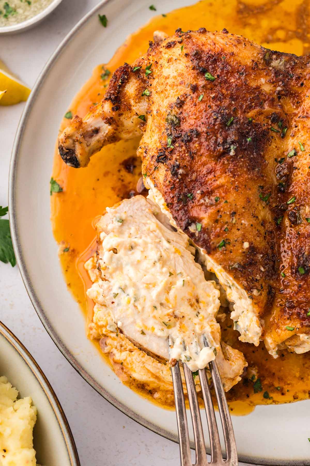 Ruth Chris stuffed chicken up close with a fork.