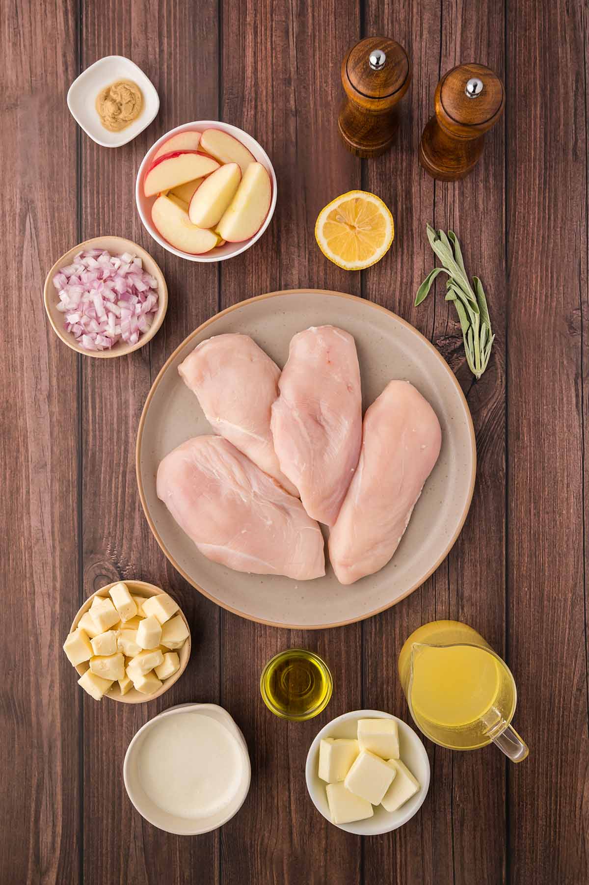 raw chicken breasts, brie, chicken stock, butter, oil, sage, shallots, mustard, lemon, cream, apples, and spices.